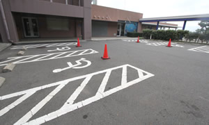 Emergency and wheelchair parking spaces next to the entrance